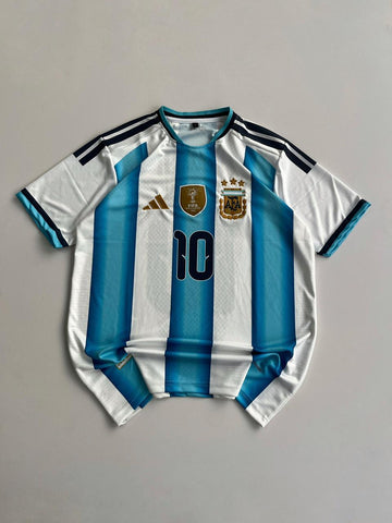 Argentina FIFA World Cup Home Jersey – Messi #10 Champions Edition🏆(Embroided)